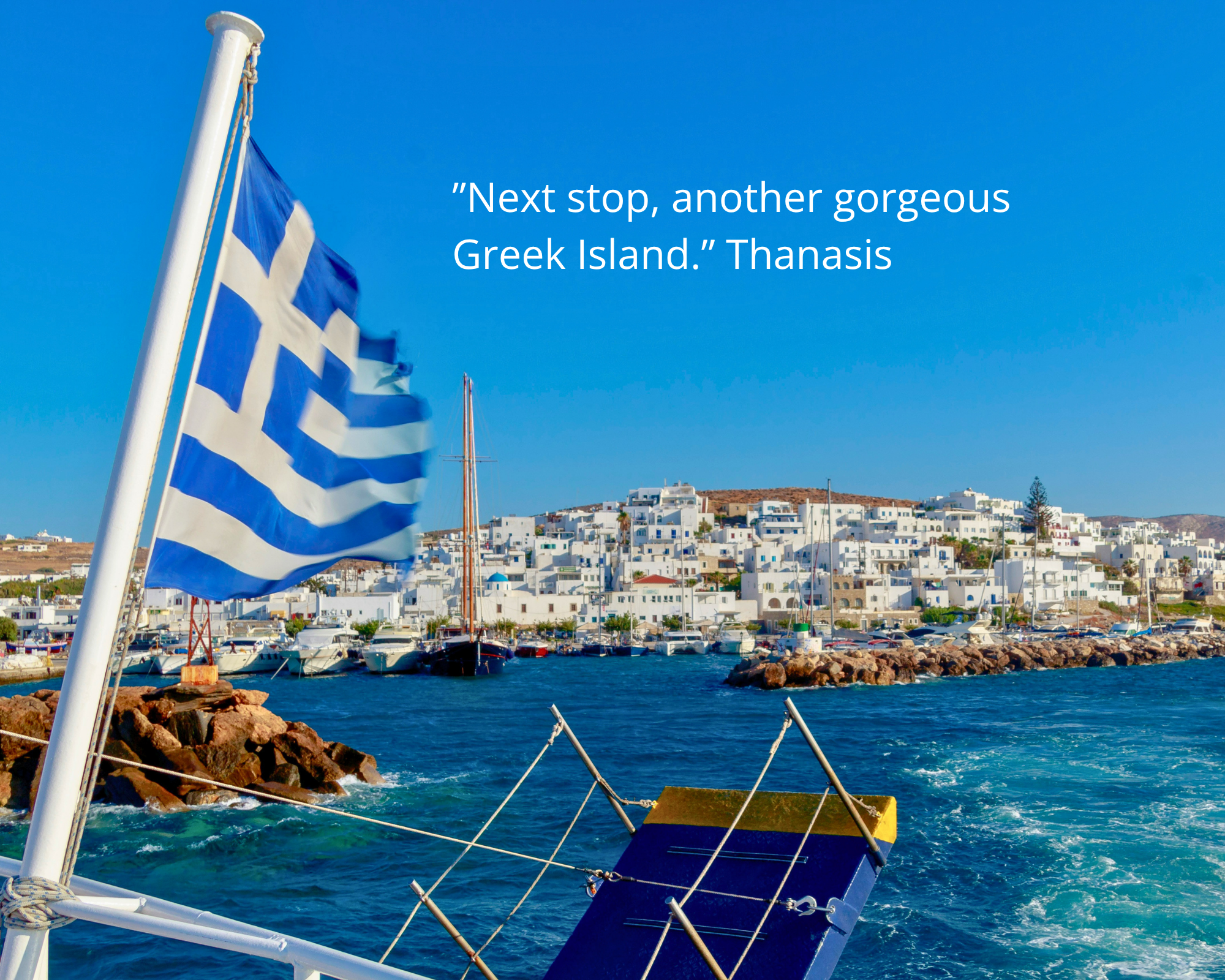 The view from a ferry deck arriving into a Cycladic port, Greek flag flying - Monobrow Ferries